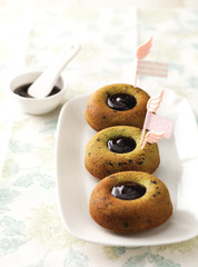 chocolate syrup topping 3 cakes on table