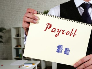 Business concept meaning Payroll with sign on the sheet.