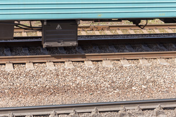 blue passenger train moving fast