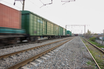freight train moves fast during sunset.