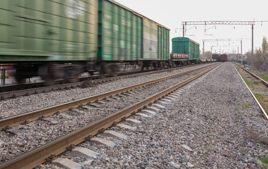 Fototapeta na wymiar freight train moves fast during sunset.