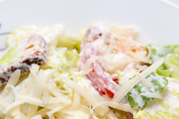 vegetable cabbage salad with mayonnaise and cheese, eggs on the table