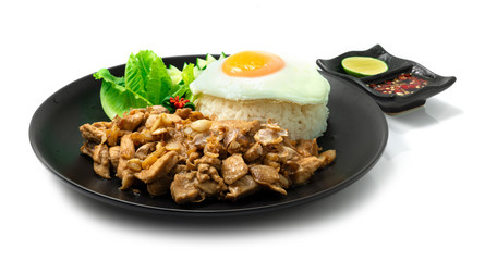 Fried Chicken Garlic with Rice ontop Fried Egg decorate Carved vegetable served Chili fish Sauce
