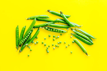 Set of green pea pods on bright background