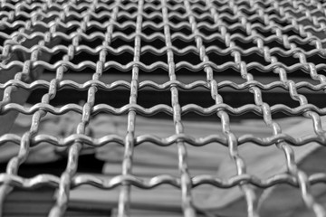Close-up of a gray metal mesh or railing.