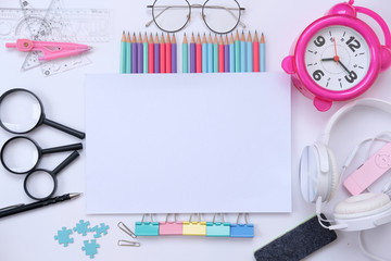 Back to school. colorful Items for the school on white background and notebook space for text