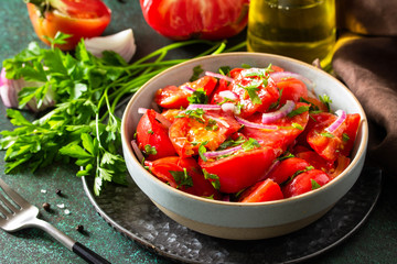 Summer Vegetable salad with fresh tomato, onion and olive oil. Healthy food.