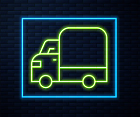 Glowing neon line Delivery cargo truck vehicle icon isolated on brick wall background. Vector.