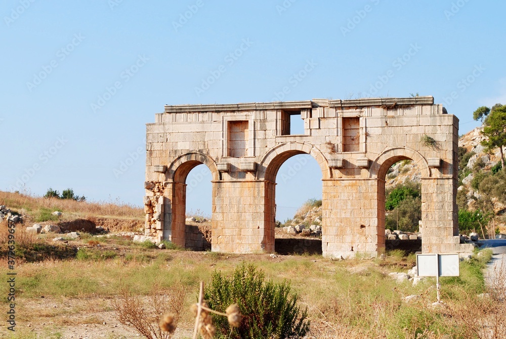 Wall mural The gate of the ruins in Xanthos, one of the ancient Lycian league, Unesco World Heritage site, near Fethiye, Mediterranean coast. Turkey