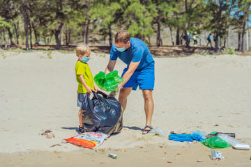 Volunteer blue face mask forest sand beach. Son helps father hold black bag for pick up garbage....