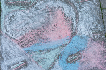 Children's drawings with chalk on the tiles