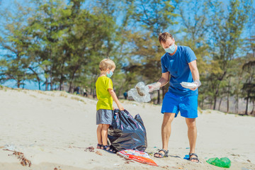 Fototapeta na wymiar Volunteer blue face mask forest sand beach. Son helps father hold black bag for pick up garbage. Problem spilled rubbish trash planet pollution environmental protection. Natural children education