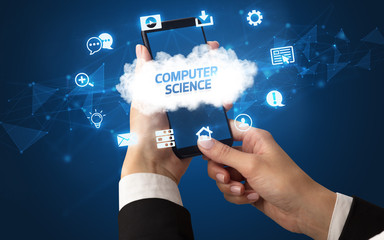 Female hand holding smartphone with COMPUTER SCIENCE inscription, cloud technology concept