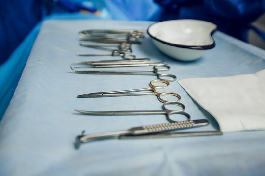 Close-up of surgical instruments in the operating room on the table. Preparation for surgery. Sterile instruments