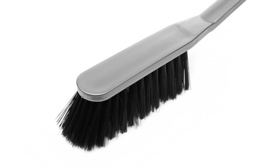 Grey cleaning brush, broom for dusting isolated on white background