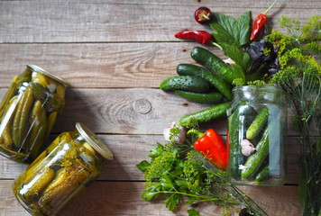 The benefits and harms of canned cucumbers.The process of home canning cucumbers in glass jars...