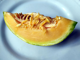 fresh healthy yellow fruit bite put in a white plate