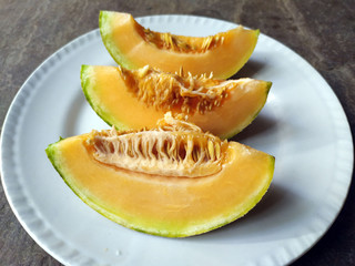 fresh healthy yellow fruit bite put in a white plate