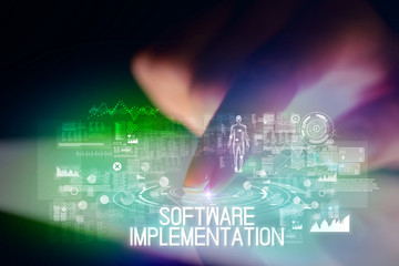 Finger touching tablet with web technology icons and SOFTWARE IMPLEMENTATION inscription
