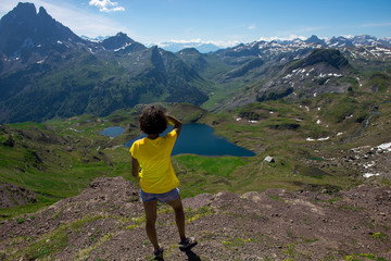 Fototapeta premium hiking woman looking Pic du Midi Ossau in french Pyrenees mountains