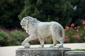 Fototapeta na wymiar statue of stoned lion in Wallach french park in Mulhouse