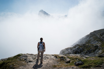 unrecognizable woman looking at a mountain