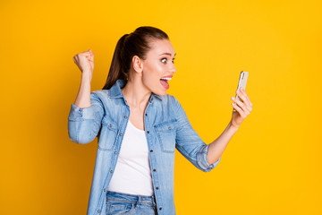 Photo of ecstatic crazy girl use smartphone read social network followers subscribers news raise...