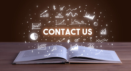 CONTACT US inscription coming out from an open book, business concept