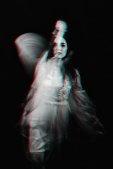 portrait of a Ghost girl in a dress with blurred on a dark background