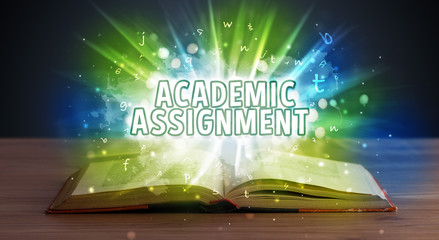 ACADEMIC ASSIGNMENT inscription coming out from an open book, educational concept