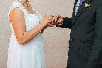 traditional wedding ceremony of exchange of gold rings between the bride and groom