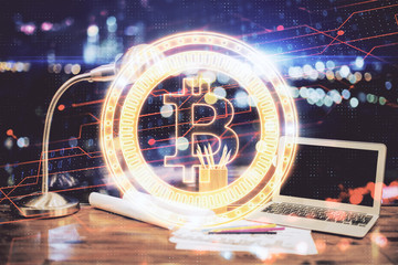 Double exposure of blockchain and crypto economy theme hologram and table with computer background....