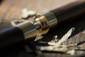 Naklejka premium Tea knife close-up on a wooden table.