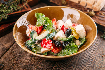 Greek salad with fresh vegetables cheese olives 