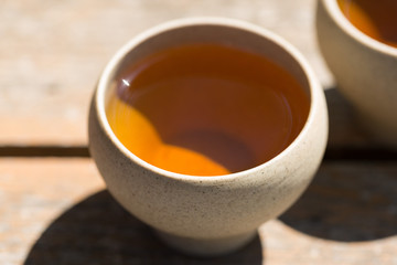Ceramic bowls made of clay on a wooden background.