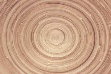 Texture of sawn wood in the form of a spiral. Abstract natural background