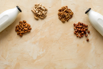 Set of non-dairy milk - almond hazelnut walnut. Top view, copy space
