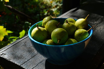 Fresh little pear in the blue plate.