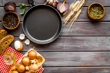 Dinner table with fresh homemade food - eggs, bread, potatoes. Overhead view