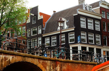 Fototapeta na wymiar Bridges over canals in Amsterdam June 2019