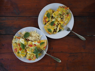 light healthy breakfast: scrambled eggs with vegetables