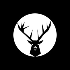 Silhouette of deer's head with antlers isolated on dark background