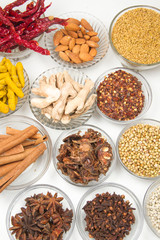 Aromatic spices on wooden spoons. Food ingradients.

