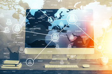 Computer on desktop with social network theme icon. Multi exposure. Concept of international connections.