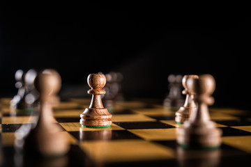 Chess game. Piece of a pawn on a chess board. Looking for a strategy.