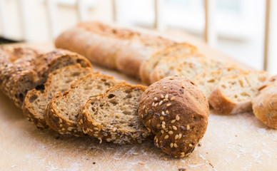 fresh loaf of bread on wooden board