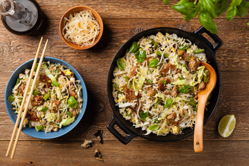 Fried veal, with rice, Chinese cabbage and mushrooms. Sprinkled with sesame and soy sauce.