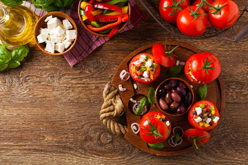 Greek stuffed tomato with feta cheese, olives, and fresh pepper.