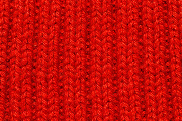 Red knitting wool texture background.	
