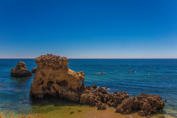 Fototapeta premium Beautiful hidden beach with beautiful blue water (Arrifes in Algarve, Portugal)